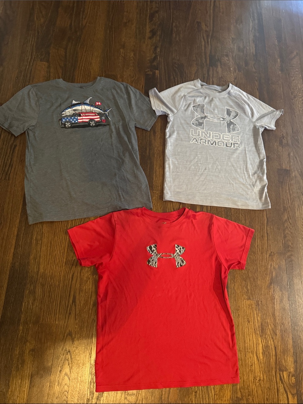 3 Under Armour Youth Large Tshirts and Under Armour blue athletic shorts